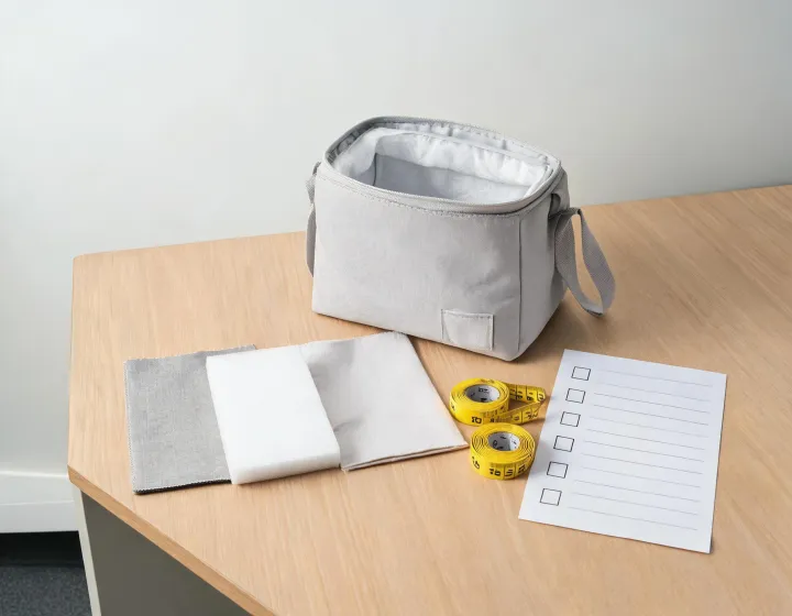 Cooler bag material review at a sample desk